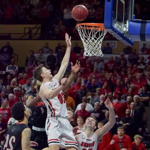 A Benedictine College Men's Basketball player makes a basket