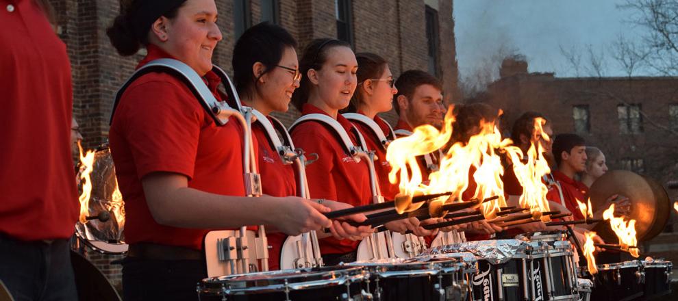 Drum Corps marching during the Homecoming 2016 parade